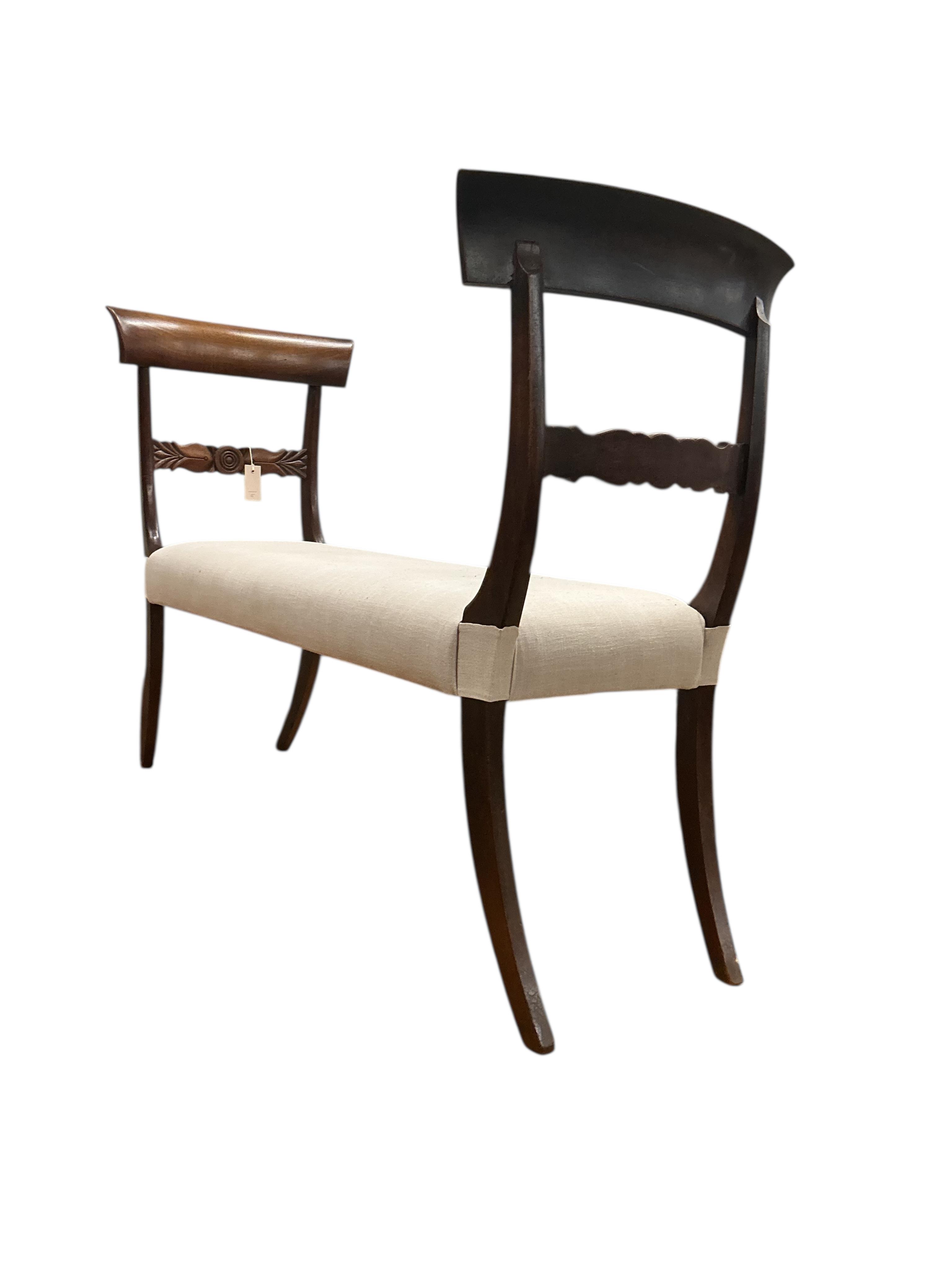 A Regency style upholstered mahogany window seat, adapted incorporating old timber, width 120cm, depth 38cm, height 88cm